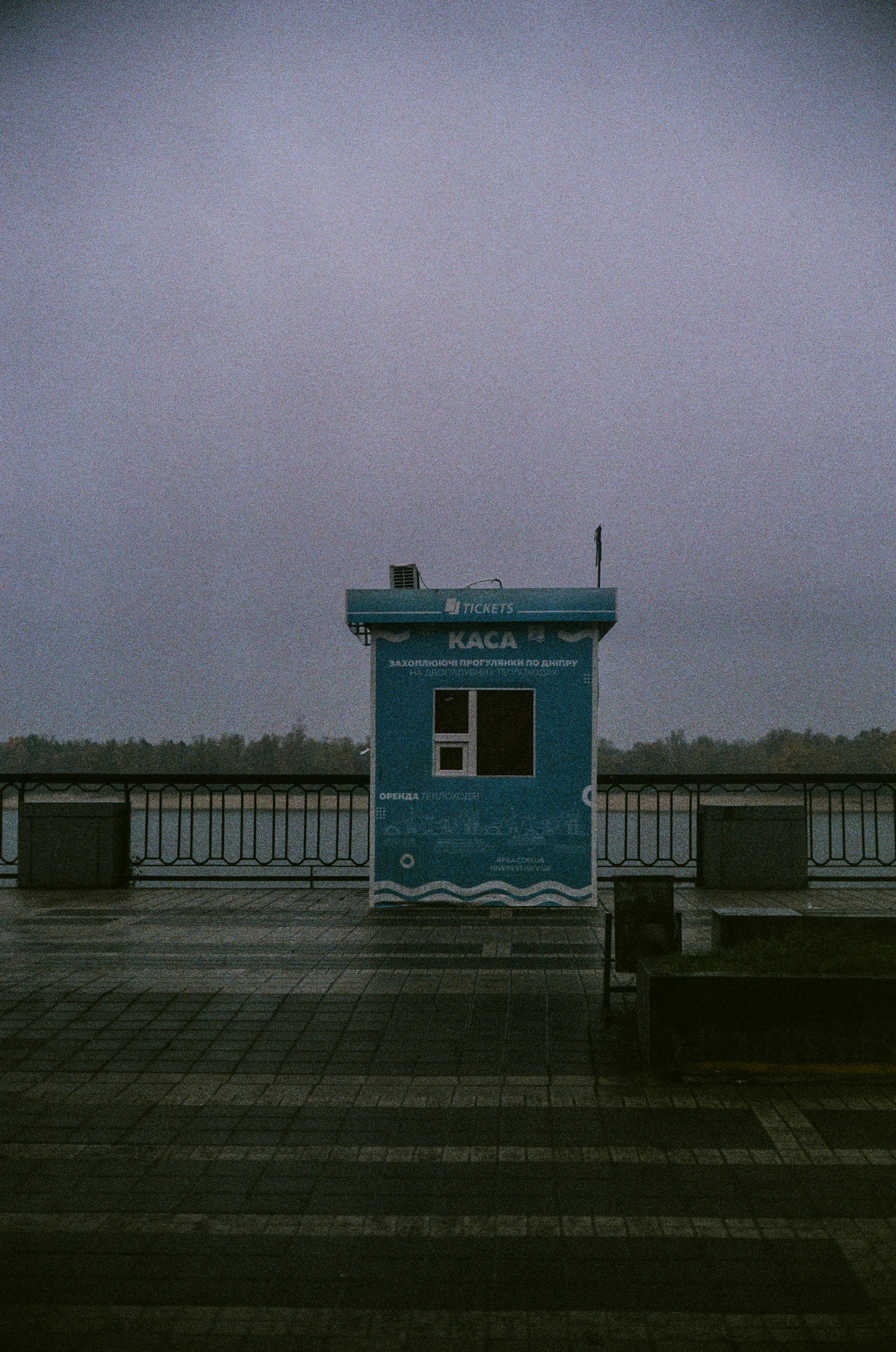 blue and white concrete building near body of water